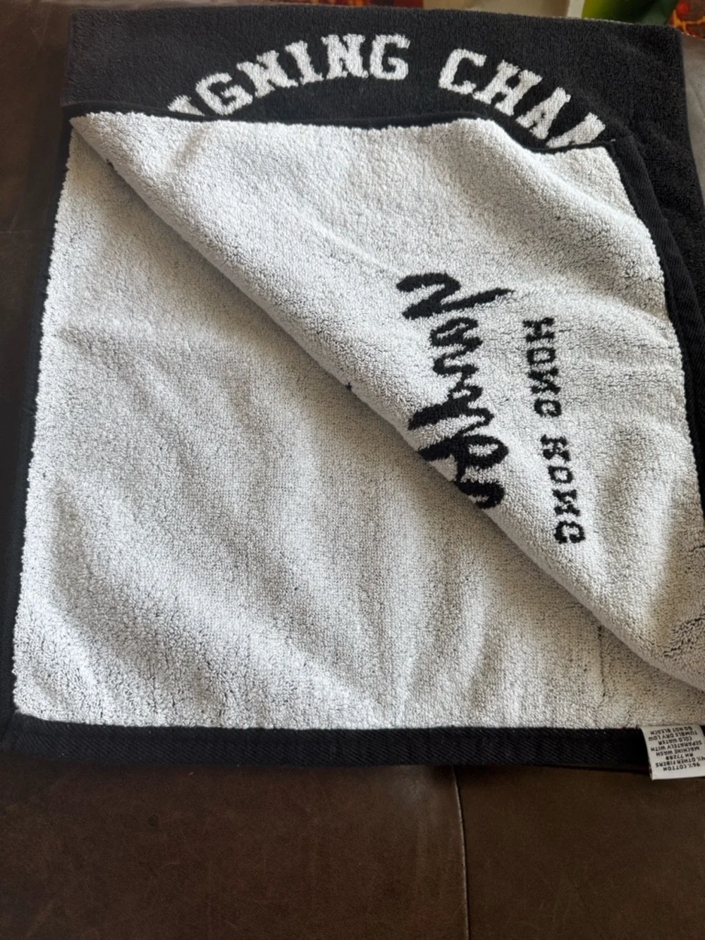 Reigning Champ Black Towel with White Yardbird Graphic
